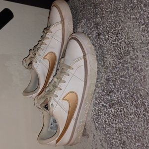 Youth size 5 Nike's rose gold and white